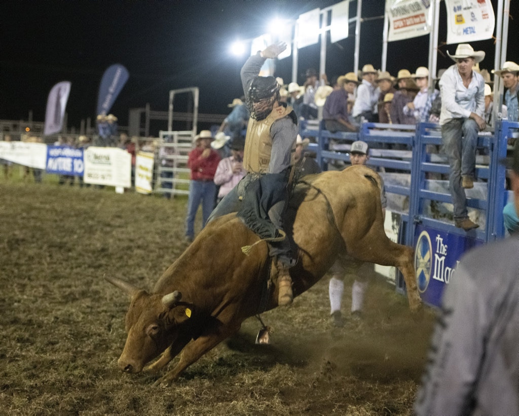 Gerard Oversby rides in the top eight chute out at the Lawrence Twilight Rodeo. Picture: Adam Hourigan