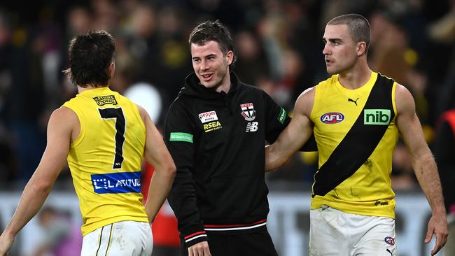 Jack Higgins talks with former Richmond teammates Liam Baker and Jack Ross after the Saints rolled Richmond. Picture: Quinn Rooney/Getty Images