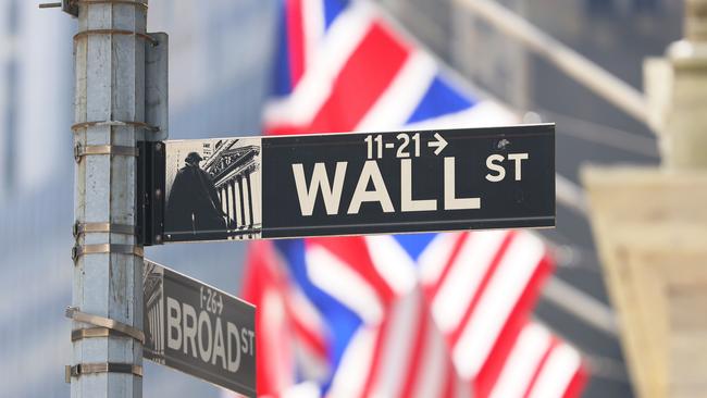 NEW YORK, NEW YORK - SEPTEMBER 13: The Wall Street street sign is seen at the New York Stock Exchange during afternoon trading on September 13, 2022 in New York City. U.S. stocks opened lower today and closed significantly low with the Dow Jones dropping over 1,200 points after the release of an inflation report that showed prices rising more than expected in the last month. The Consumer Price Index released by the Bureau of Labor Statistics showed prices rising 8.3% over the last year, for which economists had predicted an 8.1% increase.   Michael M. Santiago/Getty Images/AFP