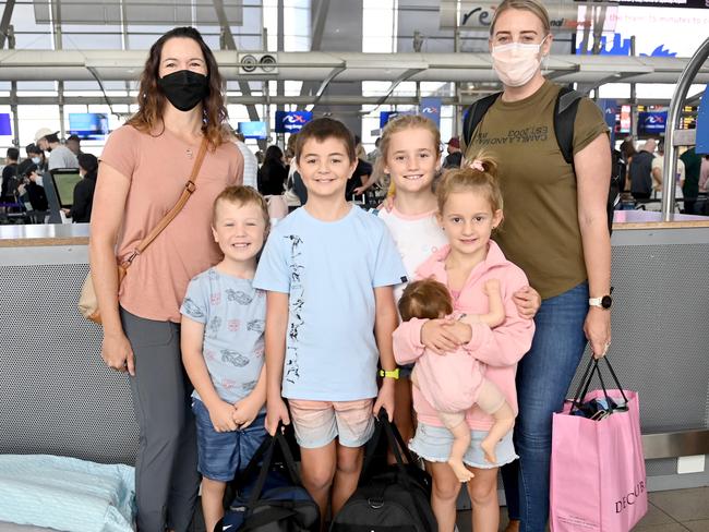 Melissa Sams (with the pink bag) with her daughters, Olivia, 7, and sister Lucy, 9, and Kristy Peters with Liam, 6, and Aidan, 9.