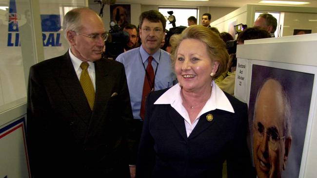 Lynton Crosby (centre) behind his then boss John Howard with wife Janette during the 2001 federal election campaign. Picture: John Feder