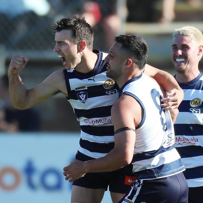 Harry Wheeler is congratulated on his third quarter goal for Yarrawonga by teammate Michael Gibbons.