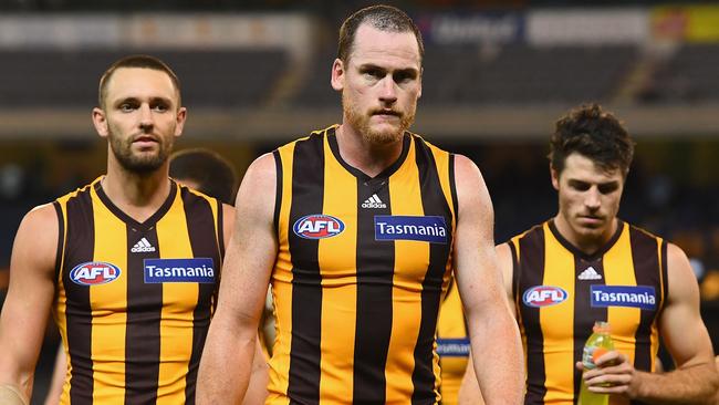Jarryd Roughead of the Hawks looks dejected as he leads his team off the field after losing against Geelong. (Photo by Quinn Rooney/Getty Images)