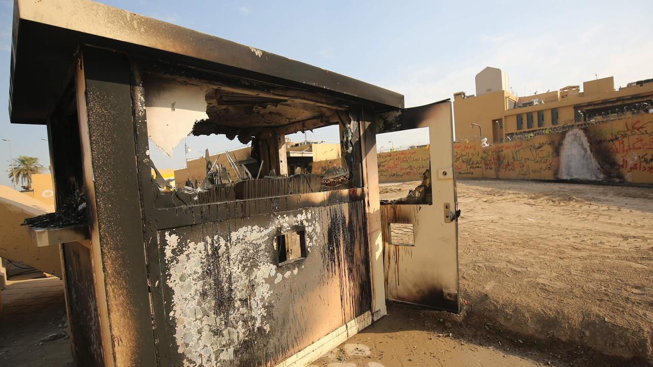 The entrance to the US embassy in the capital Baghdad on January 2 which was damaged the day before by pro-Iran supporters. Picture: AL-RUBAYE / AFP.