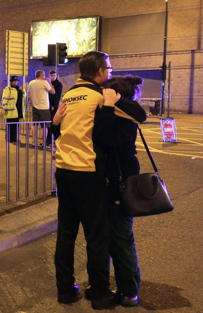 People react at Manchester Arena after reports of an explosion at the venue during an Ariana Grande gig in Manchester. Picture: AP