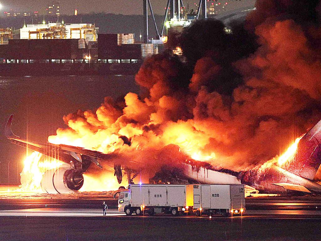 This photo provided by Jiji Press shows a Japan Airlines plane on fire on a runway of Tokyo’s Haneda Airport on January 2, 2024. A Japan Airlines plane was in flames on the runway of Tokyo’s Haneda Airport on January 2 after apparently colliding with a coast guard aircraft, media reports said. Picture: AFP