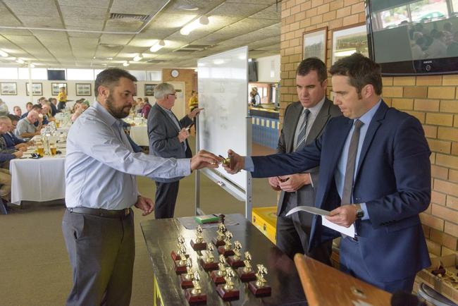 Angus McKimm representing the major sponsor of this year's Grafton Cup McKimm's Real Estate hands over the barrier number for one of the horses in the Grafton Cup draw. Picture: Adam Hourigan