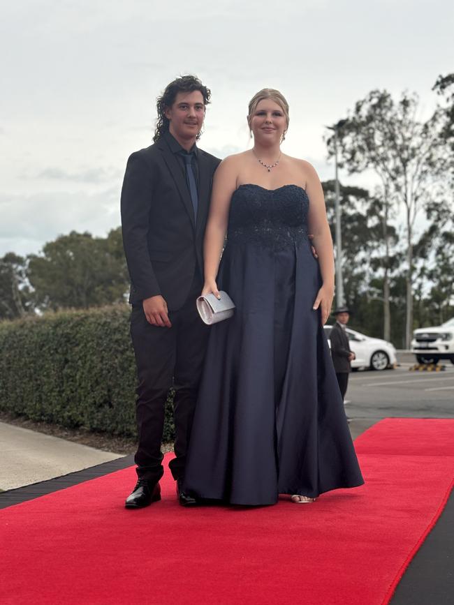 The students of Urangan State High School arriving at their formal.