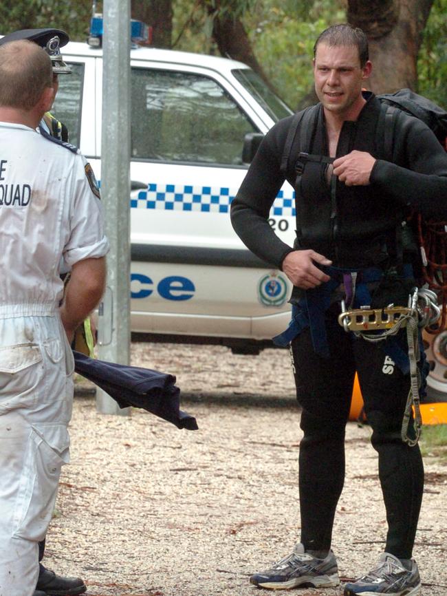 Police divers and rescue squad officers during the search for Major Donovan’s body.