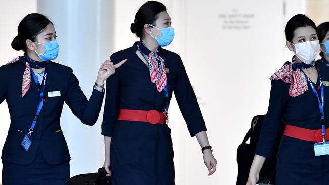 Cabin crew from China Eastern Airlines at Brisbane International Airport this week. Picture: Darren England/AAP