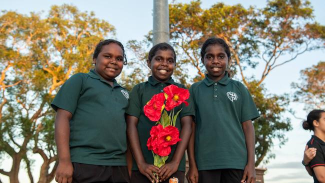 Hadassah Dickson, Indiana Charlie and Ebony Charlie as Territorians gather in Darwin City to reflect on Anzac Day. Picture: Pema Tamang Pakhrin