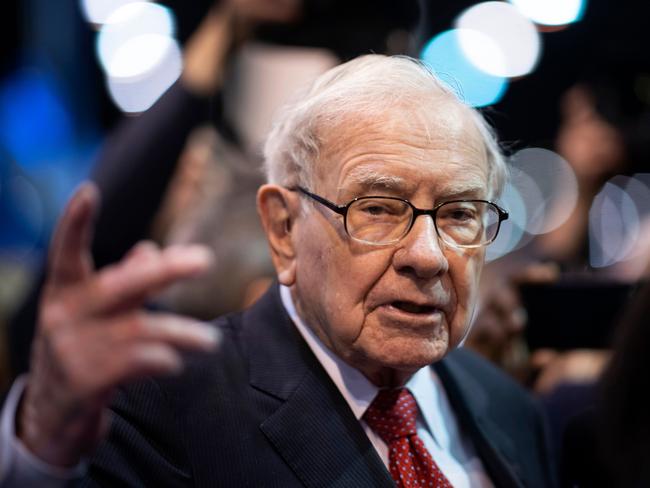 (FILES) In this file photo taken on May 04, 2019, Warren Buffett, CEO of Berkshire Hathaway, speaks to the press as he arrives at the 2019 annual shareholders meeting in Omaha, Nebraska. - Berkshire Hathaway, the holding company of Warren Buffett, bought back approximately $5.1 billion of its own shares in the second quarter as it was hit hard by economic fallout from the coronavirus pandemic. Berkshire's net profit climbed to $26.3 billion, up sharply from $14.1 billion in the same period last year. (Photo by Johannes EISELE / AFP)