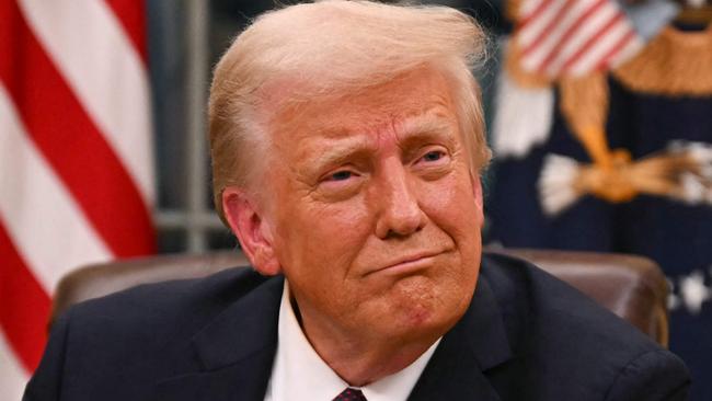 US President Donald Trump signs executive orders in the Oval Office of the White House in Washington, DC, on January 20, 2025. Picture: NewsWire / Jim WATSON / POOL / AFP