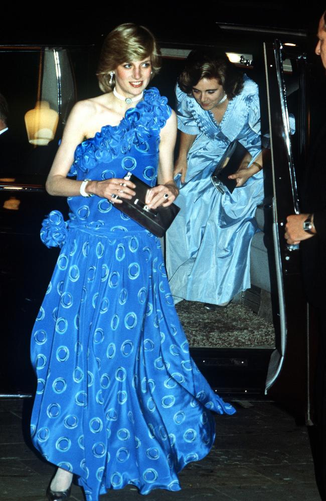 Diana’s Style: 1982 -The expectant princess made headlines in a single-shoulder, drop-waist Bruce Oldfield gown in vivid, blue silk. She was at the Guildhall in London for a fashion show. Picture: Getty