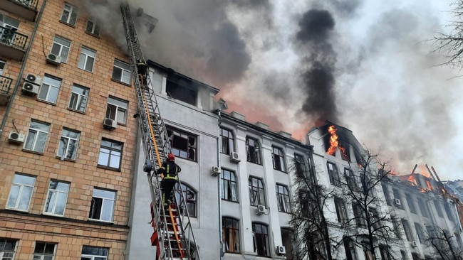 Ukrainian firefighters extinguishing a fire in the Kharkiv regional police department building. Picture: AFP/Ukraine Emergency Ministry press service