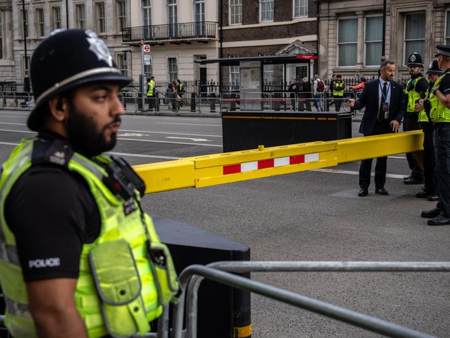 Police officers guard a roadblock near the Palace of Westminster ahead of the funeral of Queen Elizabeth II. Picture: Getty Images.