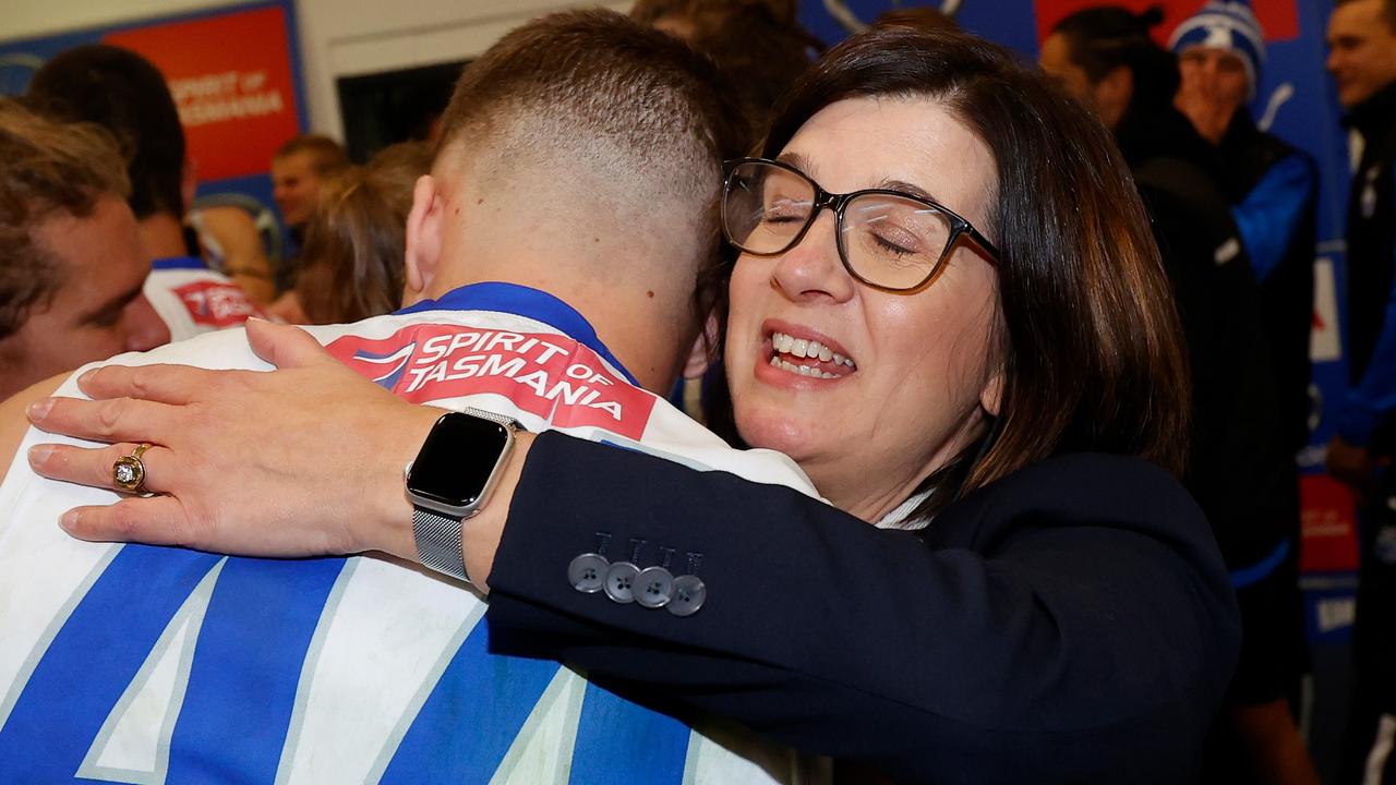 North Melbourne president Sonja Hood embraces matchwinner Cameron Zurhaar.