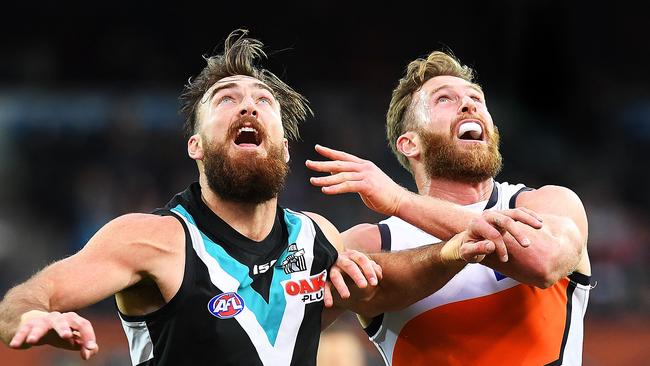 Charlie Dixon rucks against Dawson Simpson of the Giants at Adelaide Oval on Sunday. Picture: Mark Brake/Getty Images