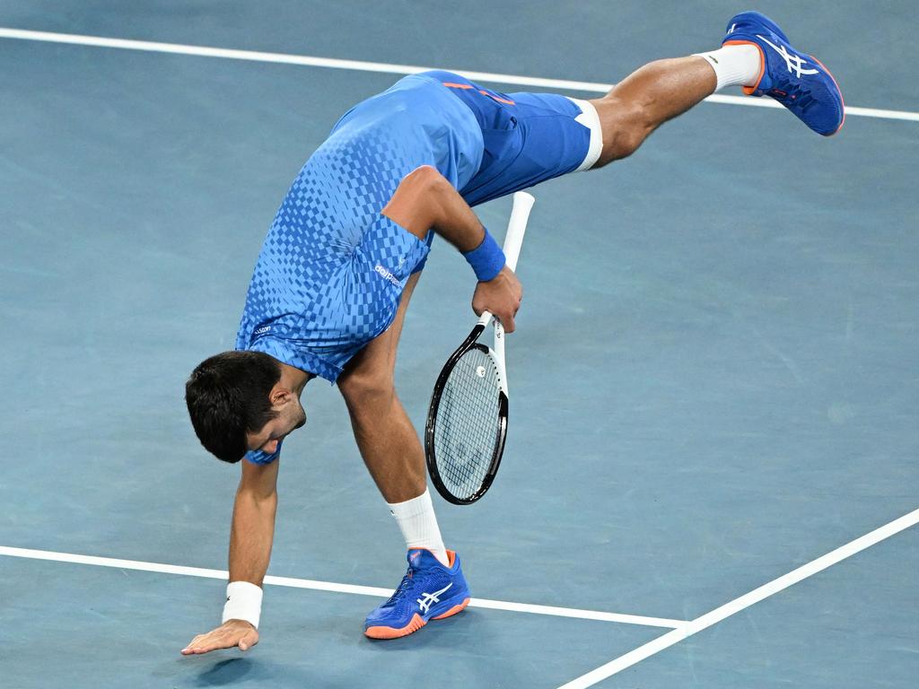 Serbia's Novak Djokovic celebrates after victory against Australia's Alex De Minaur during their men's singles match on day eight of the Australian Open tennis tournament in Melbourne on January 23, 2023. (Photo by WILLIAM WEST / AFP)