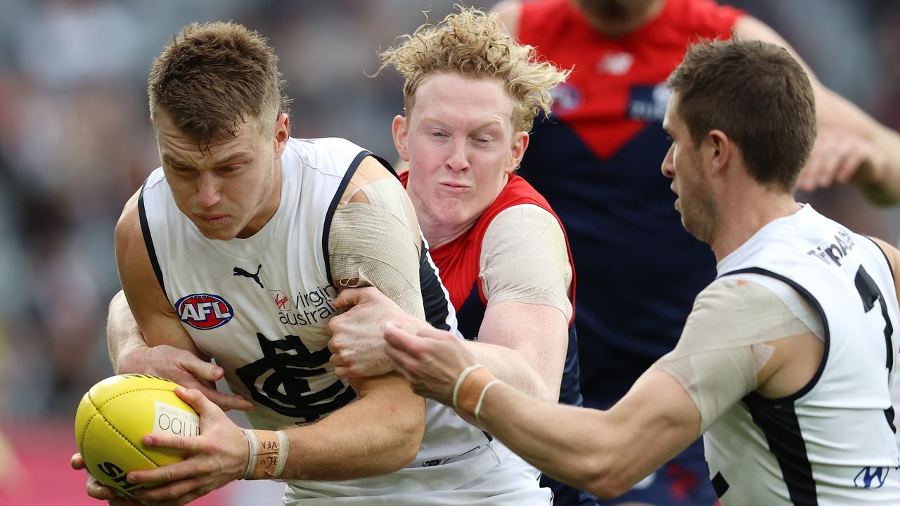 Patrick Cripps is tackled by Clayton Oliver in Melbourne’s win over Carlton. Photo: Michael Klein