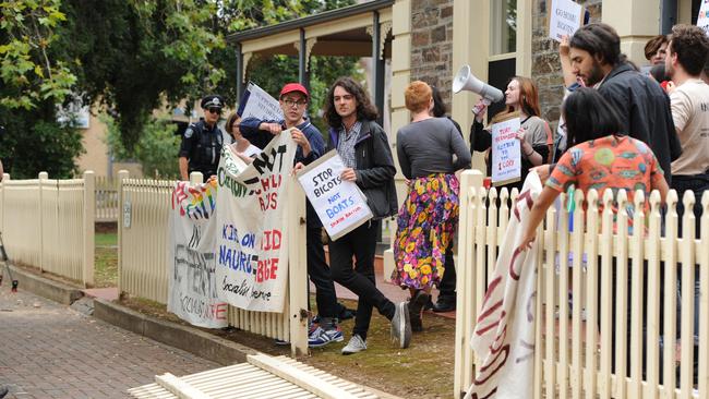 The protesters knocked down a fence outside Senator Cory Bernardi’s office. Picture: Mark Brake