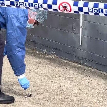 A forensics officer retrieves the firearm used in the standoff. Picture: Supplied