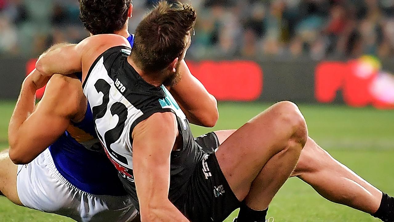 Charlie Dixon of the Power falls awkwardly during the round 21 AFL match between Port Adelaide and the West Coast Eagles at Adelaide Oval in August. Picture: Daniel Kalisz/Getty Images