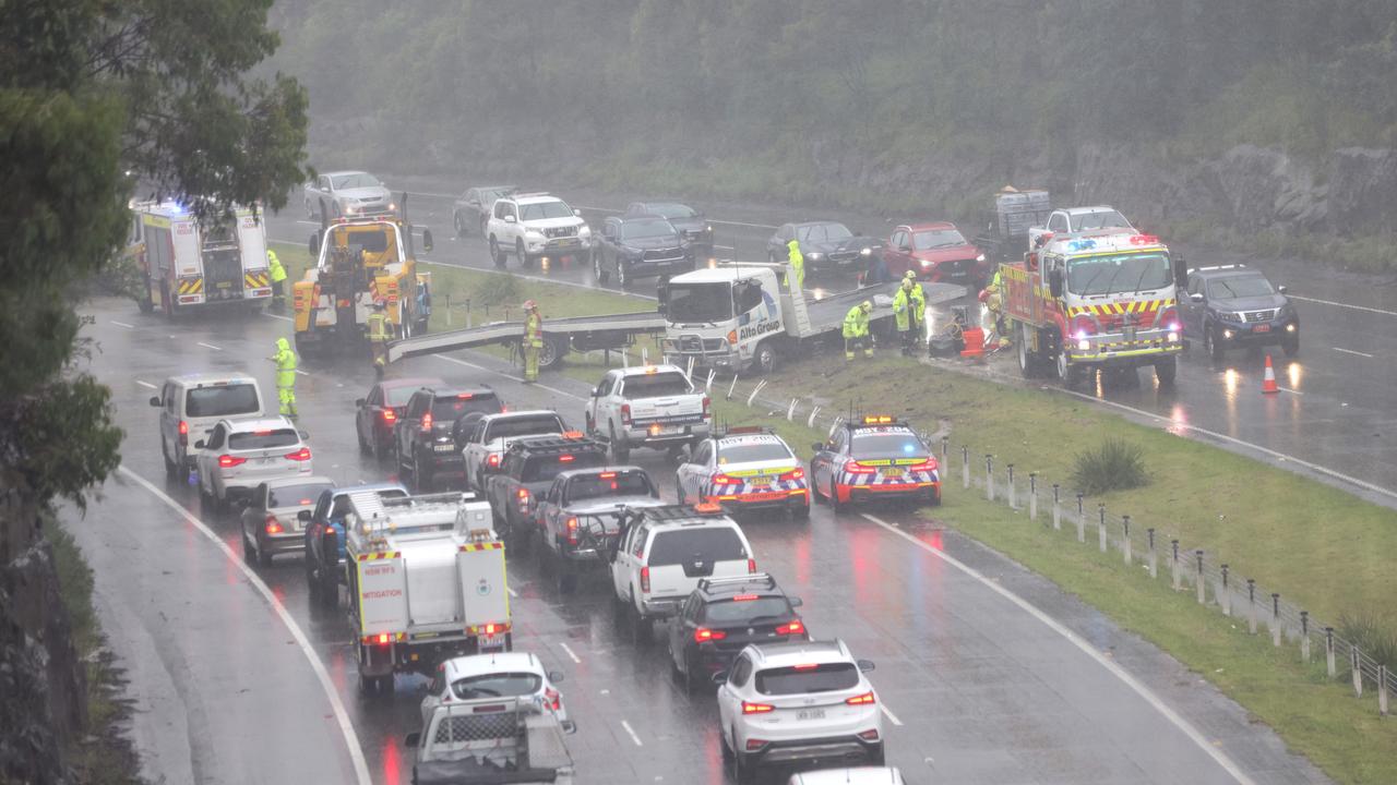 The wet weather has caused dangerous conditions on the road, with emergency crews responding to a truck crash on the M1. Picture: NCA NewsWire / Damian Shaw