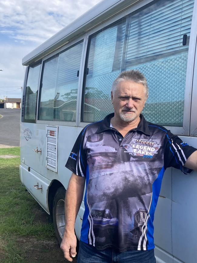 Stephen Saunders next to a bus he converted into a motor home. Picture: Arj Ganesan