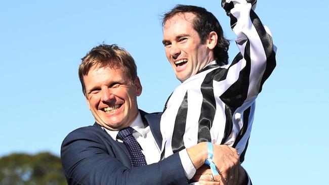 Bjorn Baker celebrating Belclare’s win in The Invitation with jockey Tyler Schiller. Picture: Jeremy Ng/Getty Images