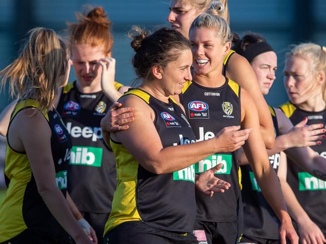 Members of Richmond’s AFLW team during a training session at Punt Road Oval. High-profile captain Katie Brennan (middle, blonde hair) is their gun recruit for their inaugural year. Picture JAY TOWN