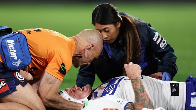 Ryan Sutton was rushed to hospital after complaining about neck pain after an ugly shoulder charge from Taane Milne. Picture: Getty Images.