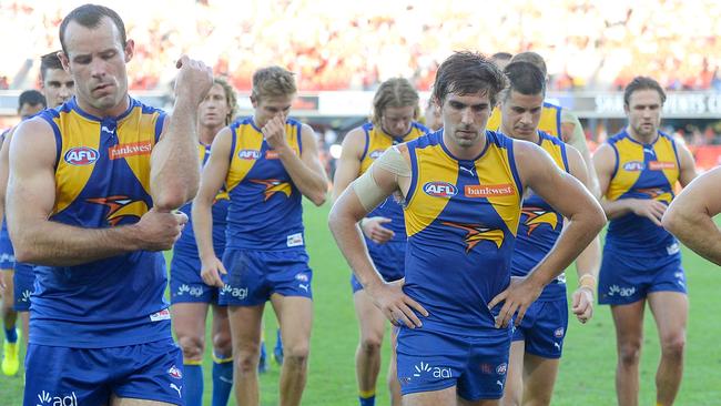 West Coast player leave the field after losing to Gold Coast.