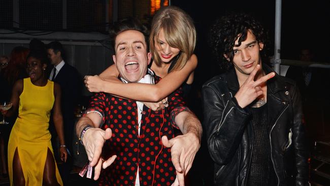 L to R): Nick Grimshaw, Taylor Swift and Matt Healy at a 2015 Brit Awards after-party. Picture: David M. Benett/Getty