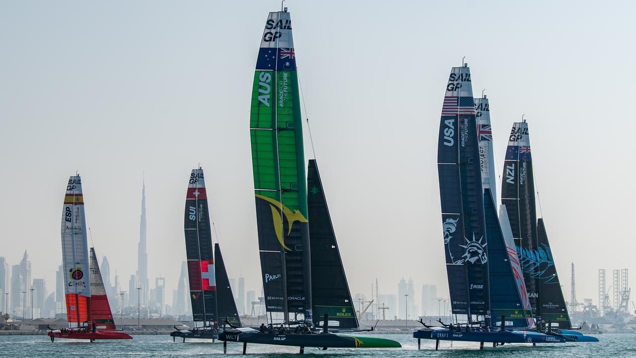 The SailGP fleet sail past the Burj Khalifa and Dubai skyline during a practice session ahead of the Dubai Sail Grand Prix. Photo: Ricardo Pinto for SailGP.