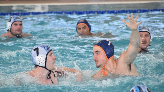 Water Polo Queensland Country Championships, 2nd World War Memorial Aquatic Centre, Rockhampton, February 18, 2023. Men, Cairns versus Gold Coast. Cairns player Ryan Barton and Gold Coast player Joshua Hayes.