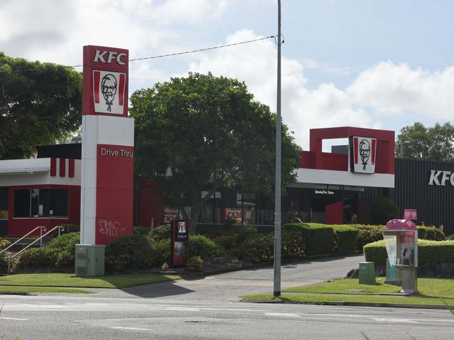 Workmen on the job at KFC Nerang, which is closed while the work is carried out. Picture Glenn Hampson