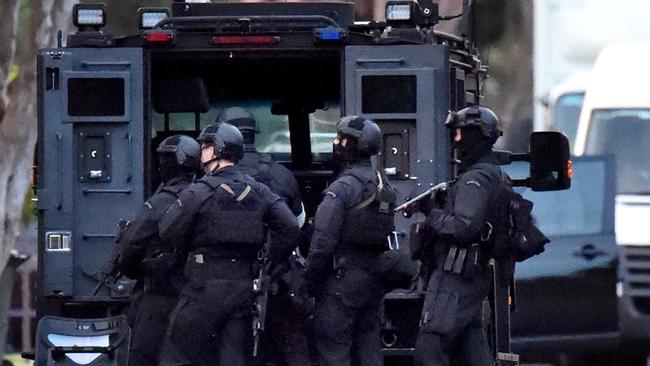 Police Special Operations Group officers deploy at a  Frankston siege. Picture: Nicole Garmston