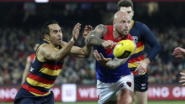 Eddie Betts heaps the pressure on Melbourne bull Nathan Jones. Picture Sarah Reed