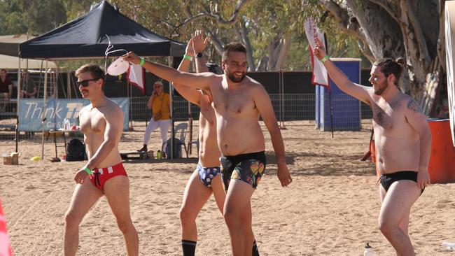 Competitors in the mens budgie smugglers race at the Henley on Todd in Alice Springs, Saturday, August 17, 2024. Picture: Gera Kazakov