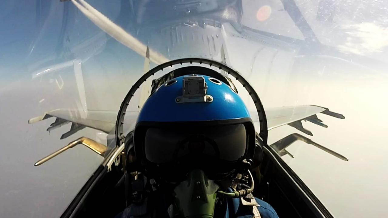 Two Chinese jet fighters during a military drill in the South China Sea in and undated photo. Picture: AFP PHOTO / STR / China OUT.