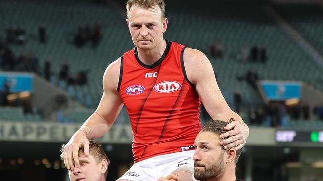 Brendon Goddard of the Bombers is chaired off after his last match