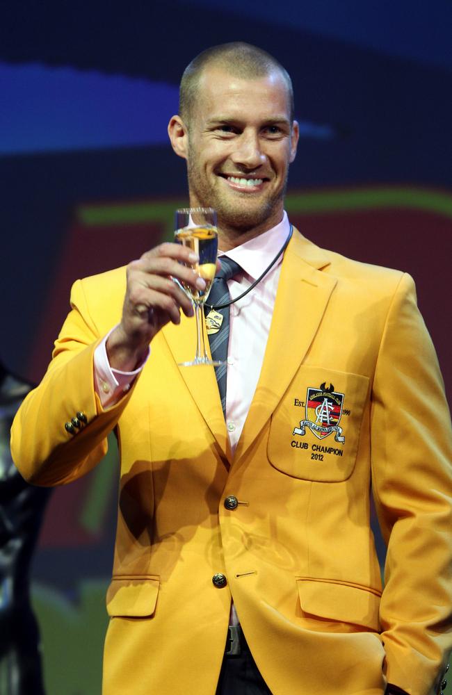 Scott Thompson toasts his 2012 Malcolm Blight Medal.