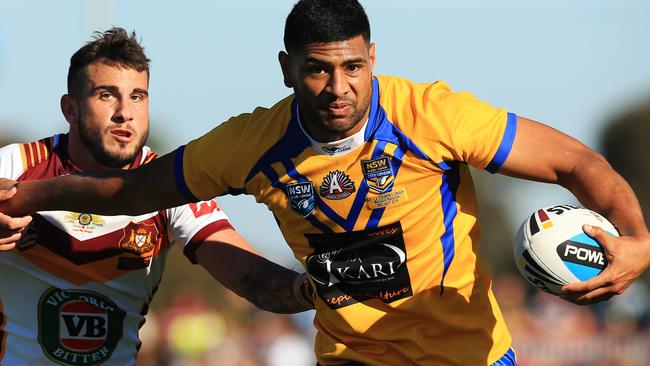 Daniel Tupou of City is tackled by Jack Bird during the City Origin v Country Origin game at McDonalds Park, Wagga Wagga in 2015. Picture: Mark Evans