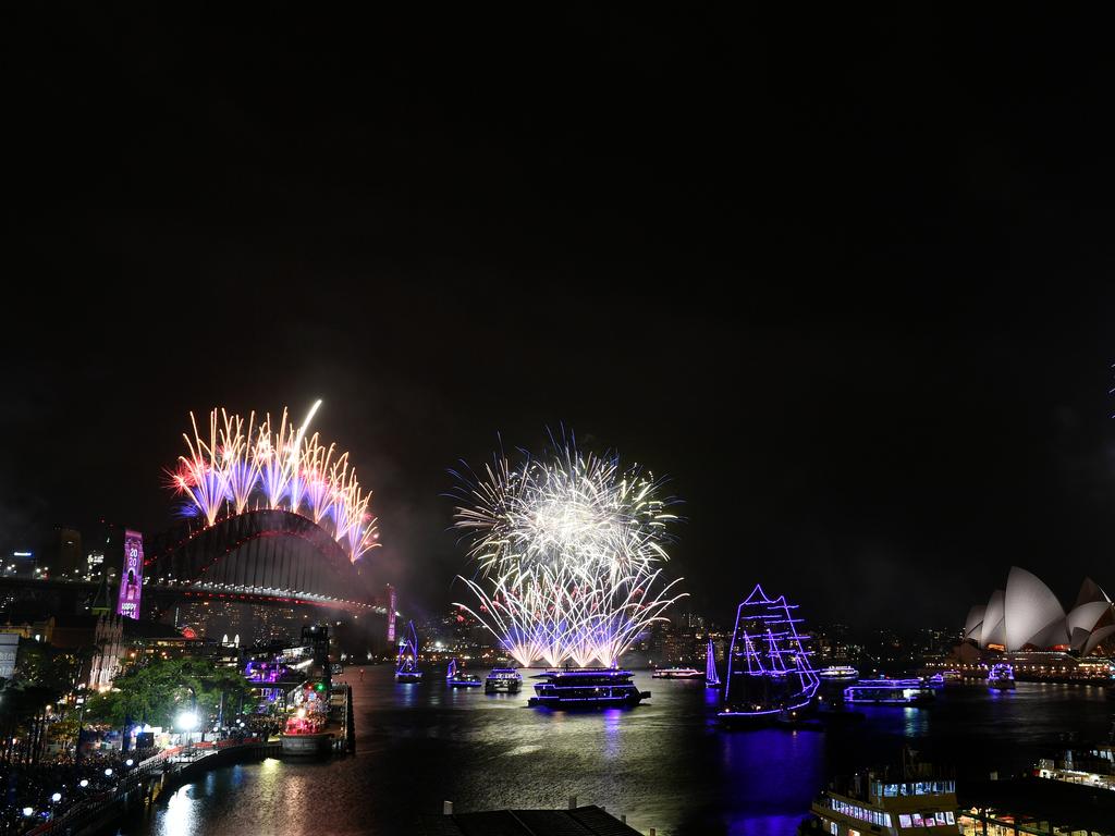 Fireworks explode to welcome in the New Year over the Sydney Harbour Bridge and the Sydney Opera House, as seen from Cahill Expressway during New Year's Eve celebrations in Sydney, Wednesday, January 1, 2020. (AAP Image for City of Sydney/Dean Lewins)