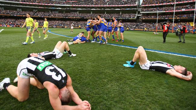 Dejected Collingwood players after their Grand Final loss to West Coast. Picture: Getty Images