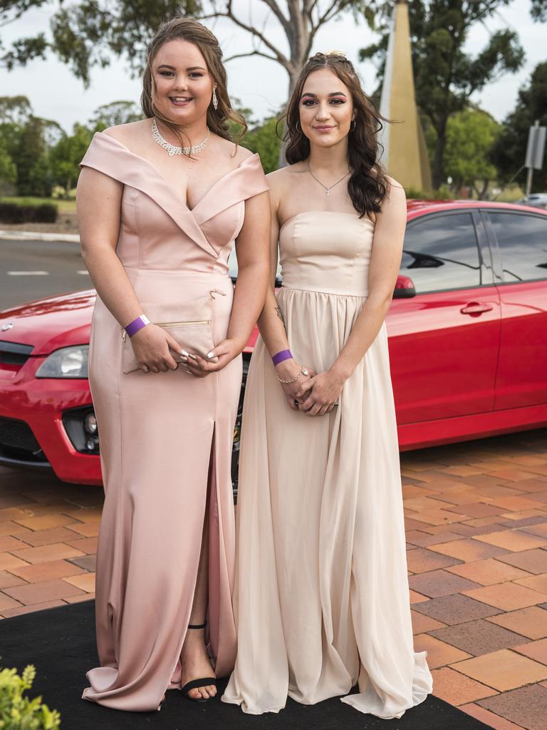 Samara Balcombe (left) and Tia Johnston arrive at Wilsonton State High School formal at USQ, Wednesday, November 18, 2020. Picture: Kevin Farmer