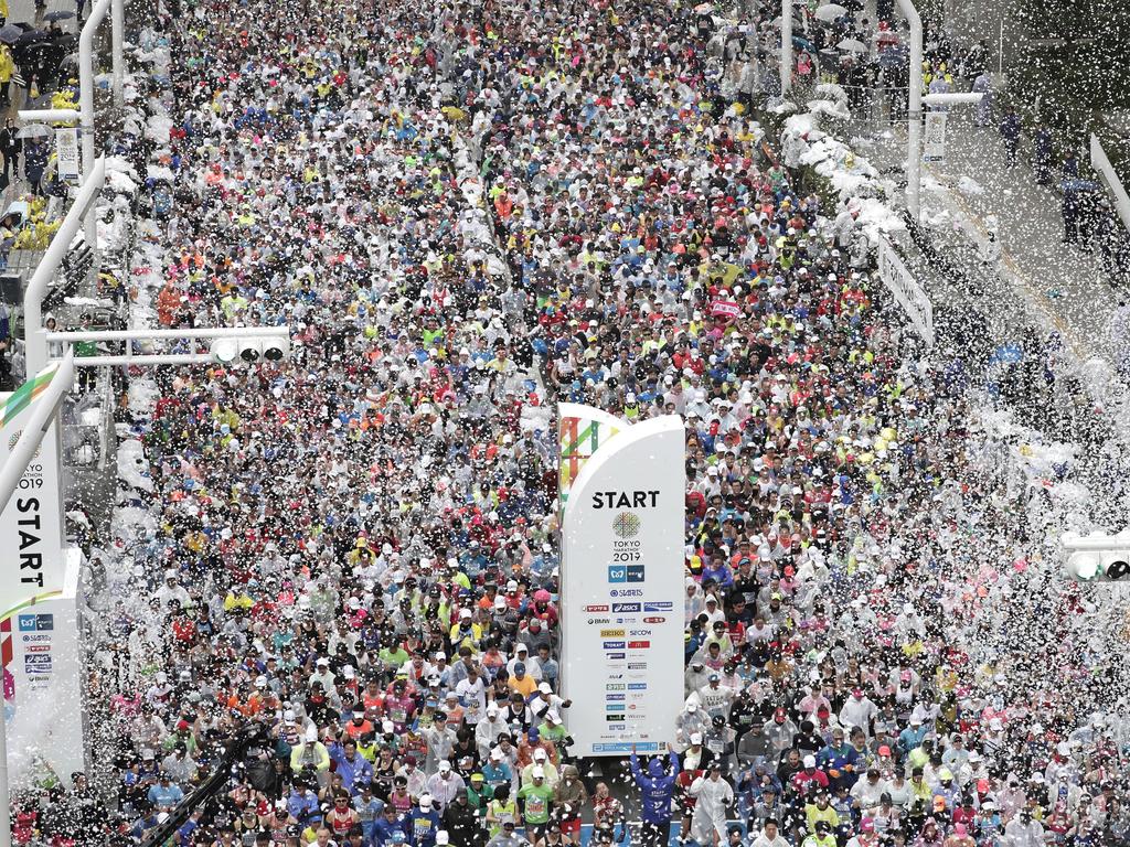 Tokyo Marathon 2020: Eerie scenes as field limited, fans stay home ...