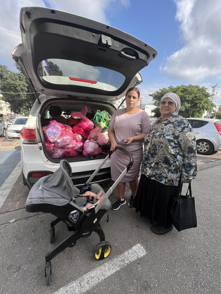 Batal Navon is stocking the boot of her car with provisions for 72 days for her grandmother Shoshana Shomkiel, 82, and grandfather Menasha, 85. Picture: Danielle Gusmaroli