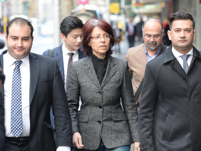 Sharobeem (centre) is accused of submitting fake invoices for services that were never provided to buy a Mercedes-Benz for her husband, liposuction for her son, Botox injections for her, clothes and groceries. Picture: Jeremy Piper